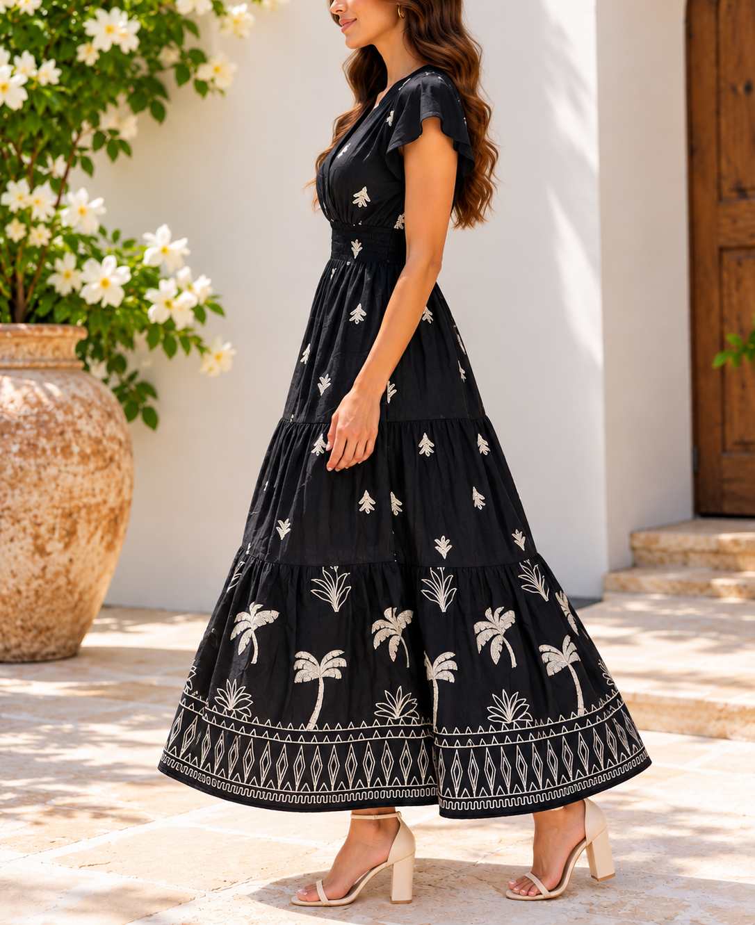 Back view of black and cream palm print maxi dress