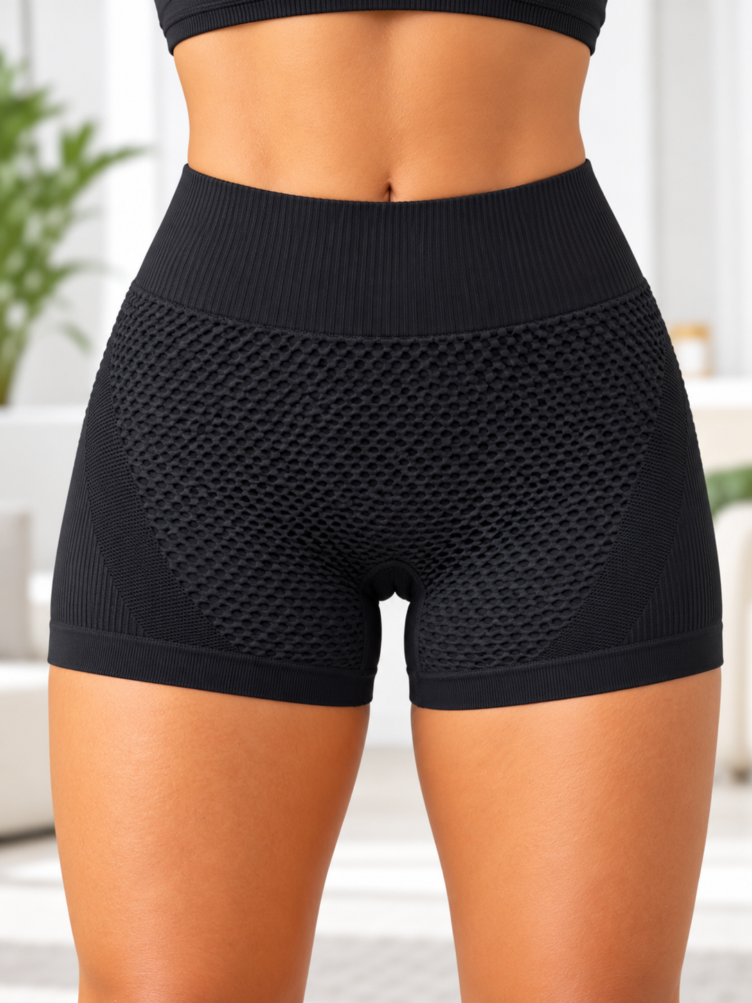 Ladies black textured scrunch gym shorts back view