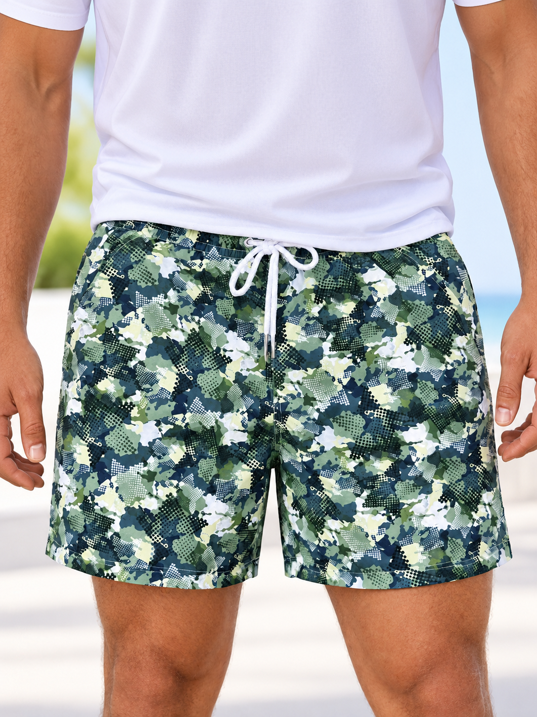 Front view of men's green camouflage shorts