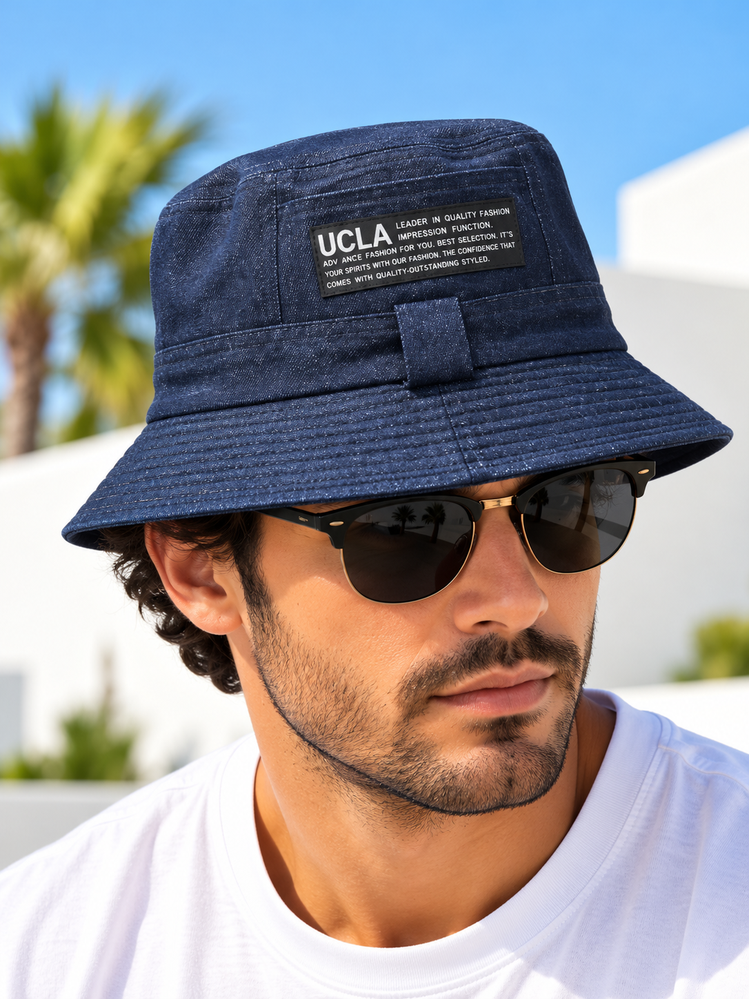 Navy textured UCLA patch bucket hat on male model