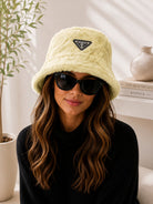 Ladies Yellow Faux Fur Bucket Hat with fashion badge emblem