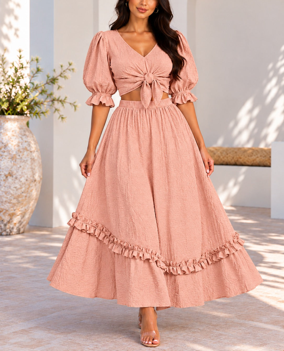 Front view dusty pink two-piece puff sleeve tie front top and maxi skirt