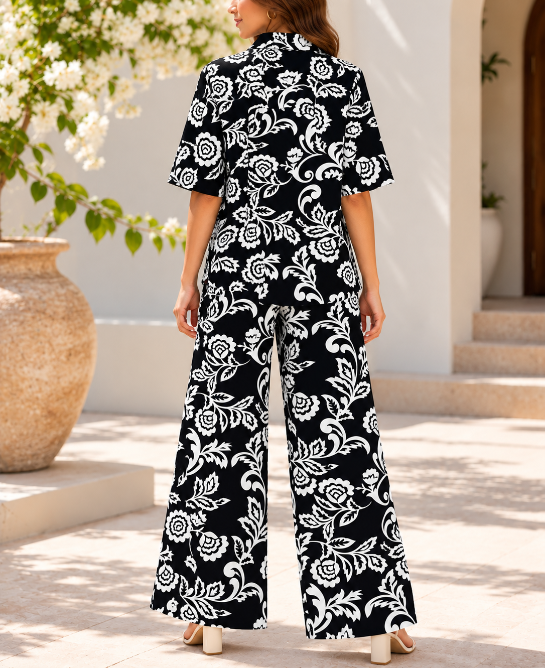 Side view of black and white floral two piece set