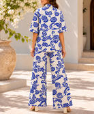 Back view of blue and cream floral two piece set
