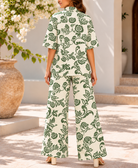 Back view of green and cream floral two-piece set