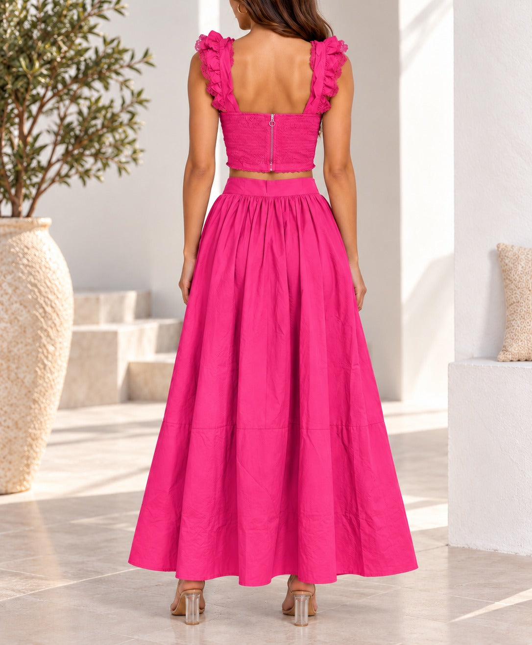 Hot pink two piece crop top and maxi skirt back view