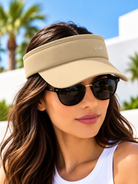 Ladies beige open-top sun visor with curved brim and front UVLABEL lettering