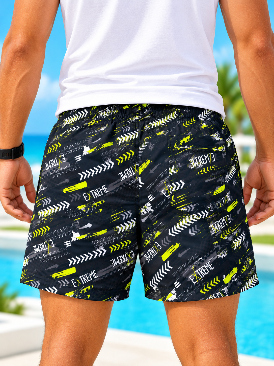 front view of men's black and neon yellow Extreme print shorts