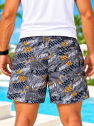 side view of men's grey and orange Extreme print shorts