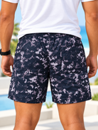 Back view of men's navy and grey abstract print shorts