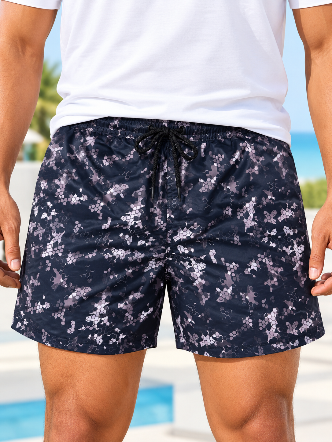 Front view of men's navy and grey abstract print shorts