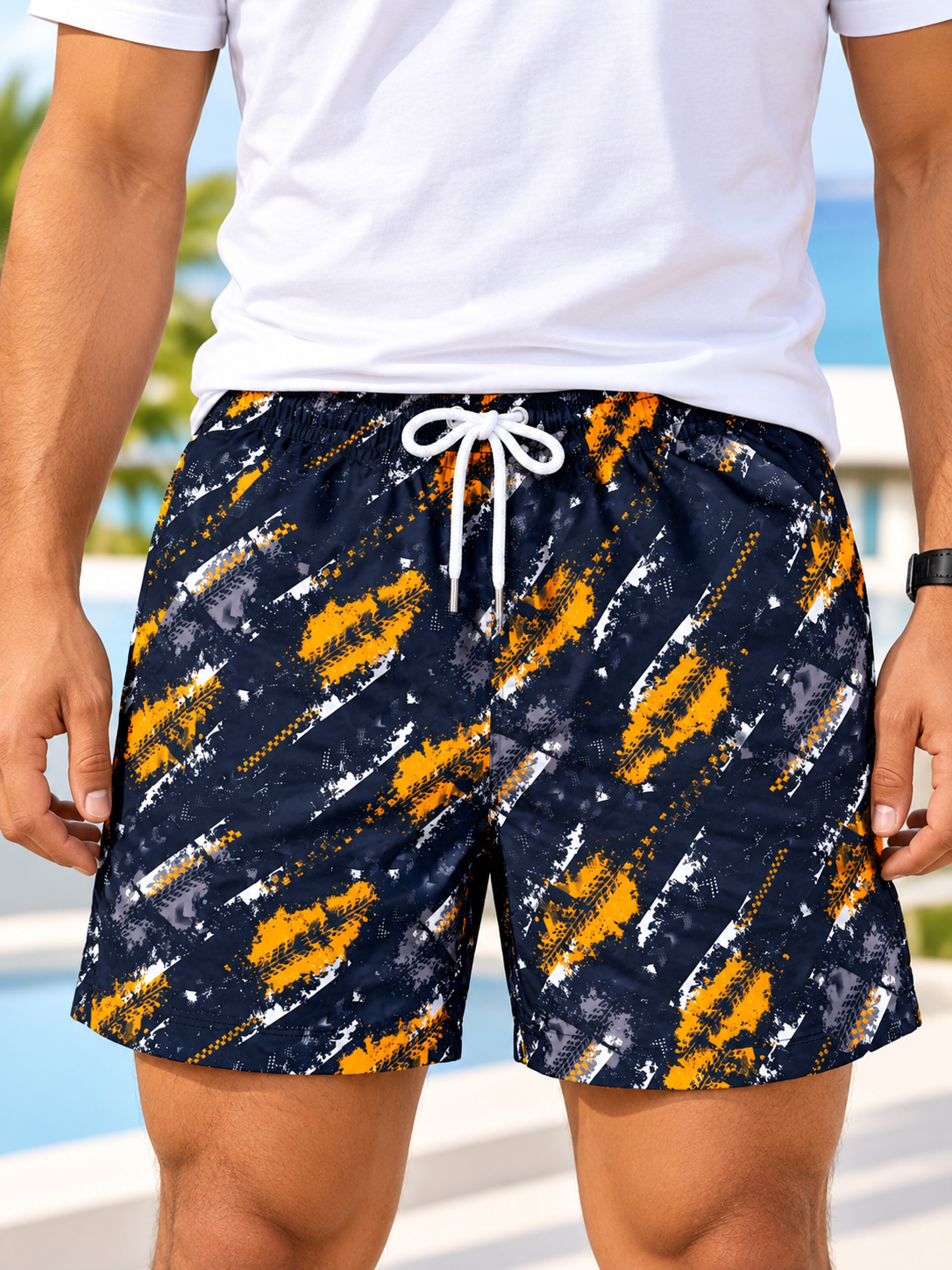 Front view of men's navy and orange abstract print drawstring shorts