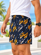 Side view of men's navy and orange abstract print shorts