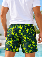 back view of men's neon green geometric print shorts