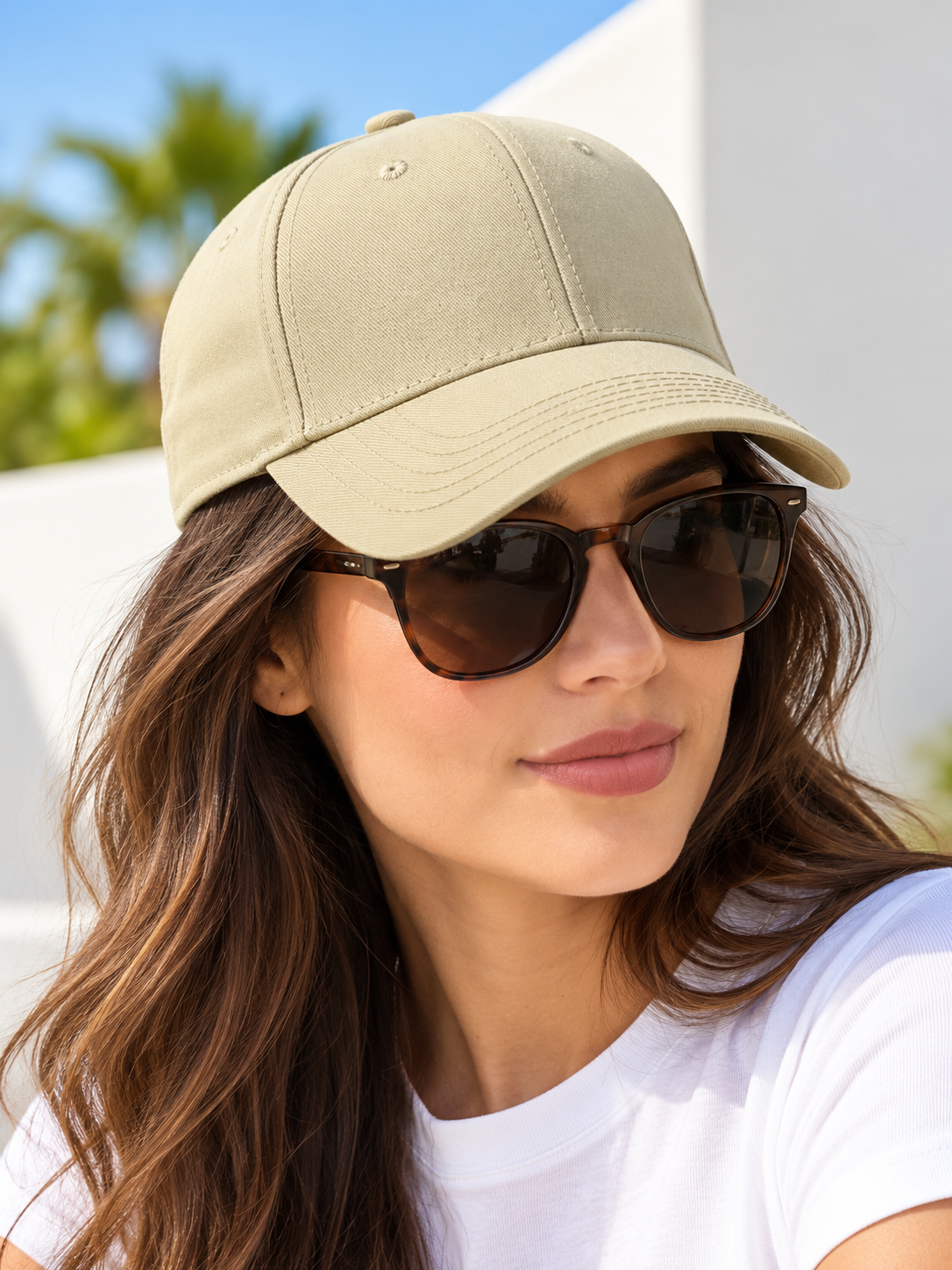 Light beige baseball cap on female model wearing sunglasses
